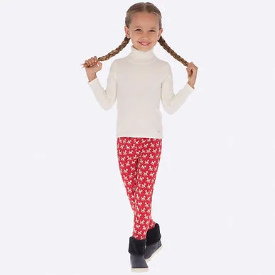 Ivory turtleneck and printed leggings