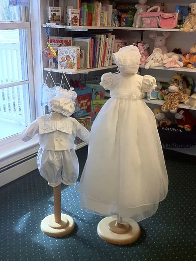 Christening dress with bonnet, in the baby room